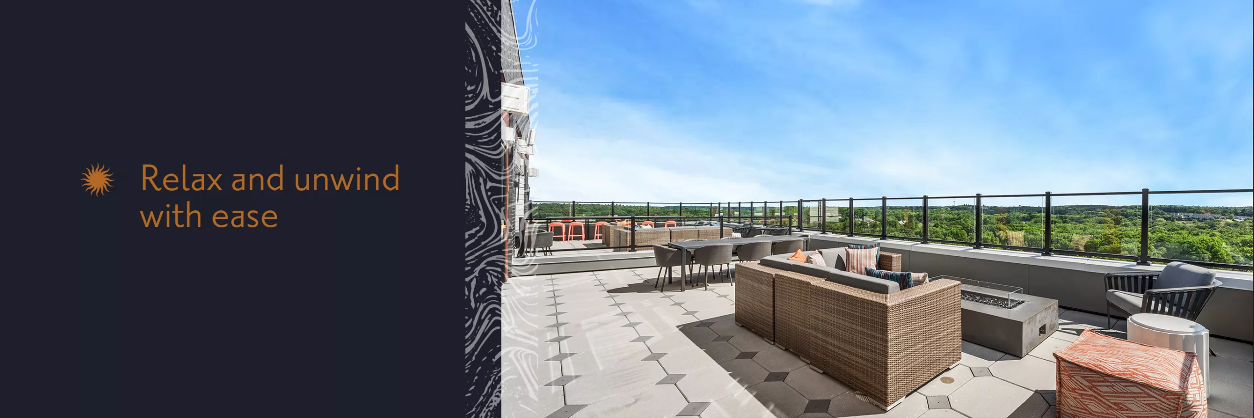 "Relax and unwind with ease" on a dark blue background to the right of a photo of a rooftop deck with couches, a firepit, and a long table and chairs under a blue sky.